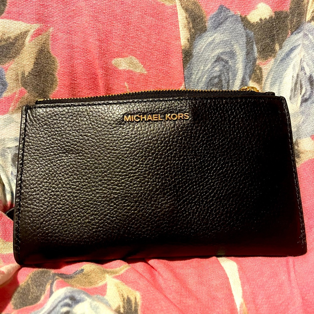 Black Michael Kors wristlet phone holder